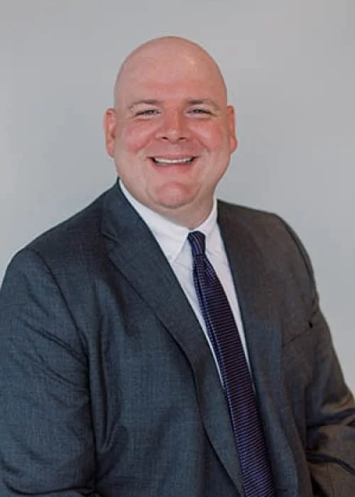 Professional co-counsel attorney at Trident Law HQ, Brian Hoven, photographed in business attire against a solid background.