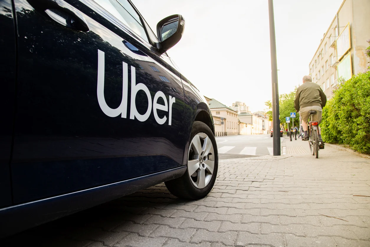 An image of a black car with the word Uber printed on the side symbolizing sexual assault involving Uber drivers, supported by legal representation at Trident Law HQ
