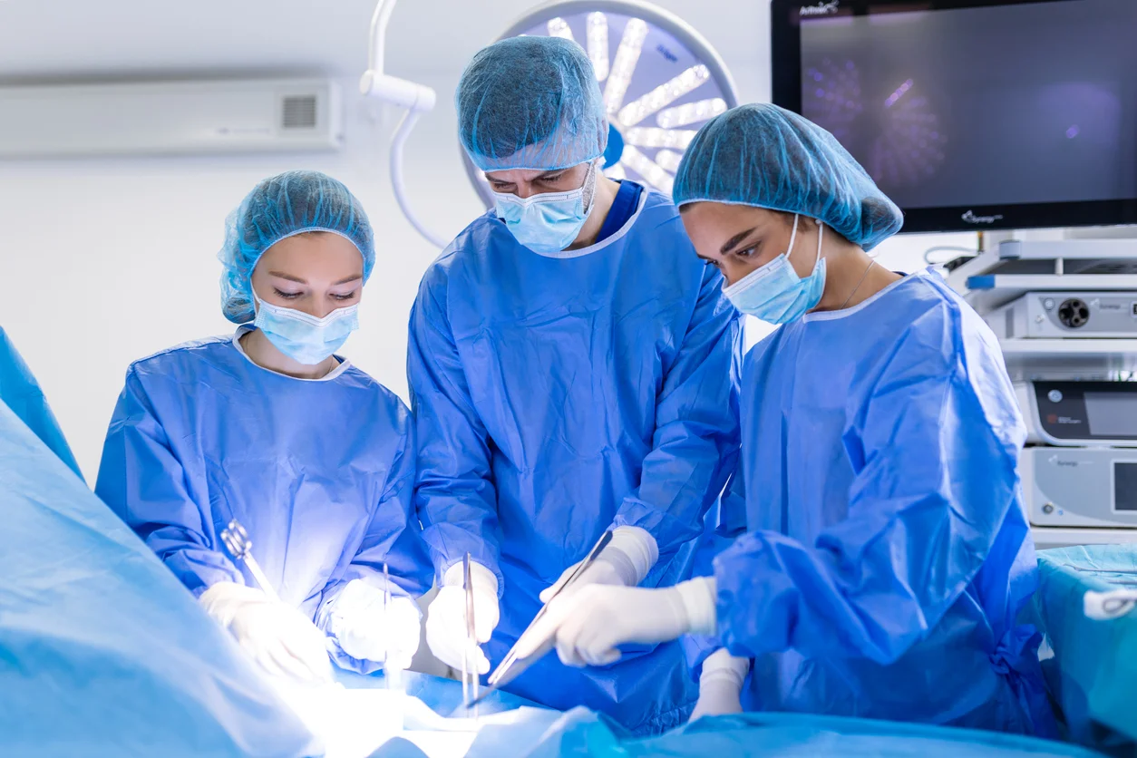 Medical team doing surgical operation, illustrating surgical error claims handled by Trident Law HQ