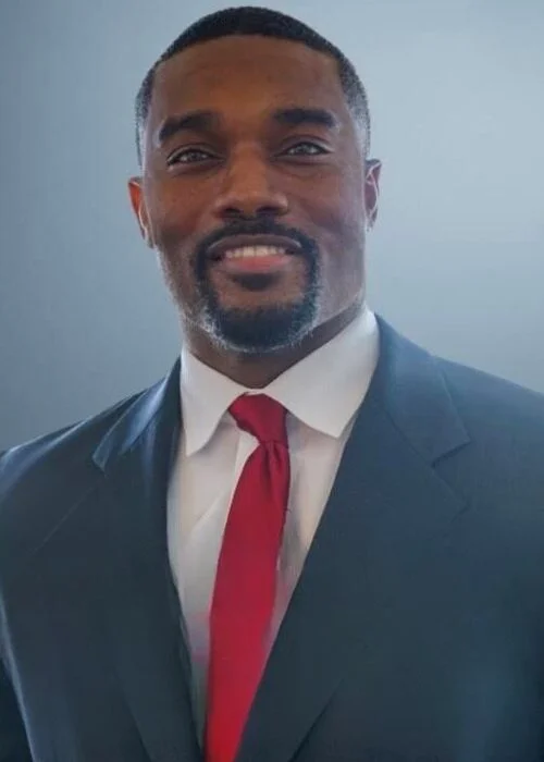 Business portrait of Muhammad Abdullah, a co-counsel attorney at Trident Law HQ, taken against a simple solid tone background.