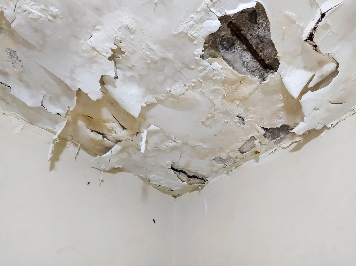 Ceiling damage from water illustrating property losses and water damage claims handled by Trident Law HQ